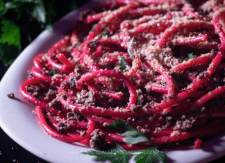 A spooky pasta dish resembling worms made with bucatini, tapenade, and breadcrumbs.
