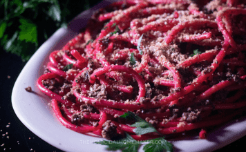 Babadook Dirt & Worms Bucatini Recipe: Horror-Themed Pasta for Mother’s Day A spooky pasta dish resembling worms made with bucatini, tapenade, and breadcrumbs.
